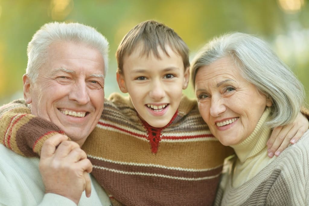 Grandparents Laughing with Their Grandchild